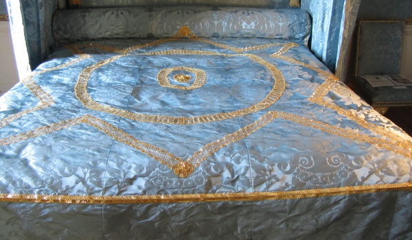 The state bed showing some of the lace in place after restoration