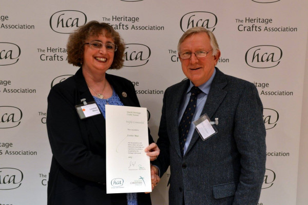 Louise receiving the award from Nick Carter, Marsh Christian Trust